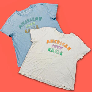 2 x American Eagle light blue and cream graphic t-shirts with a retro vibe